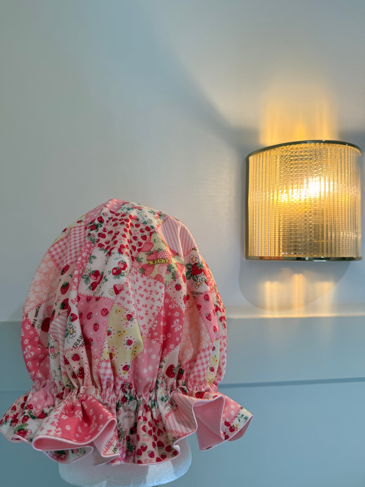 Patchwork strawberry design bonnet, with luxurious light pink satin inside.